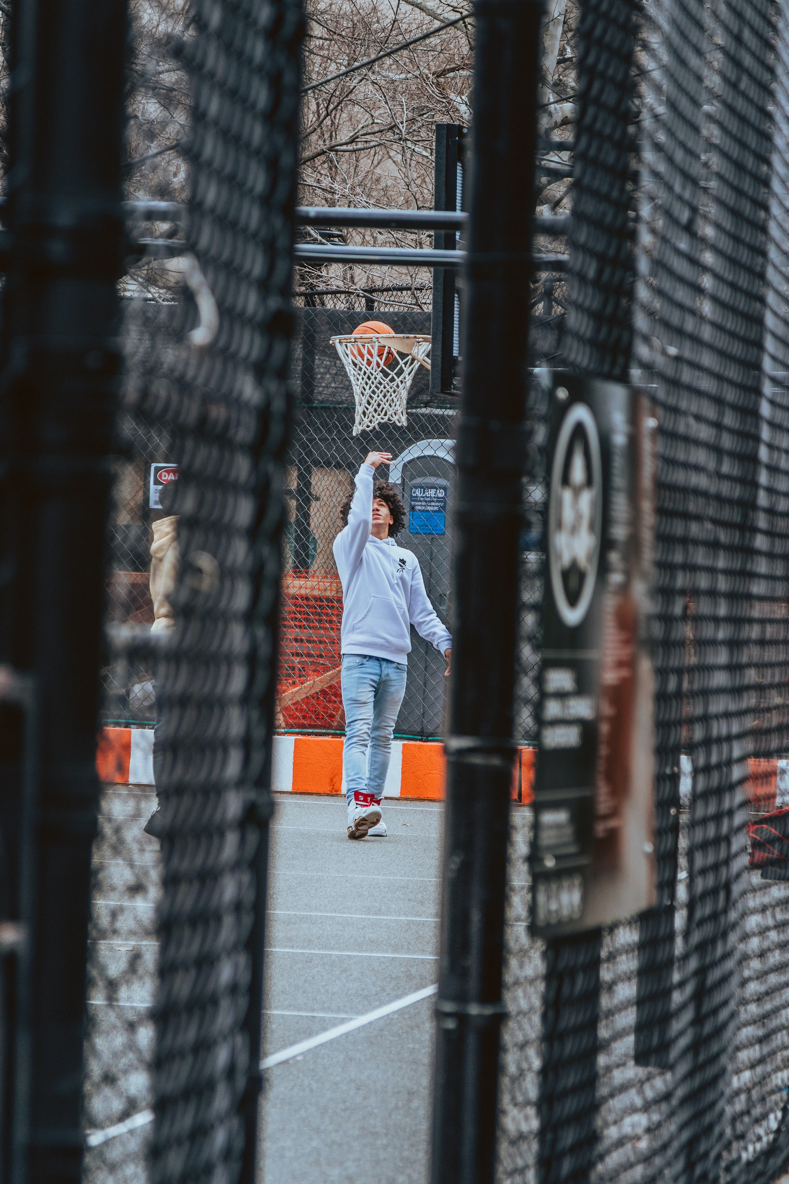 Man tossing basketball in air
